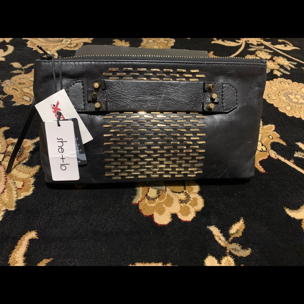 SHE + LO black and gold clutch